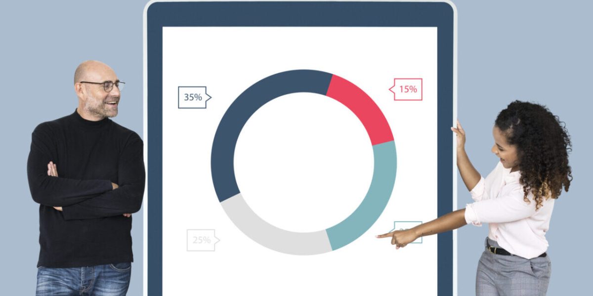 Cheerful diverse people showing pie chart on a tablet